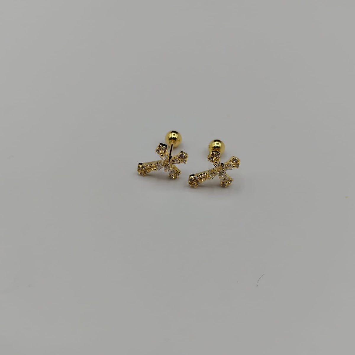 Topos Cruz de Luz · Oro laminado con rosca de seguridad